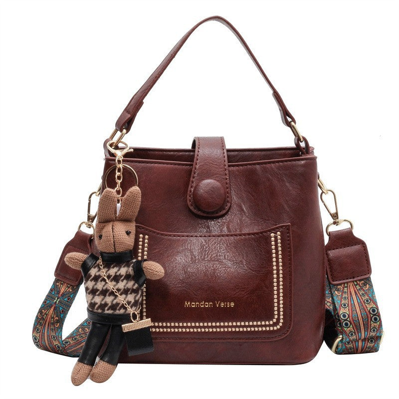 PU Leather Bucket Shoulder Crossbody Bag Patterned Strap Rabbit Charm Red Brown