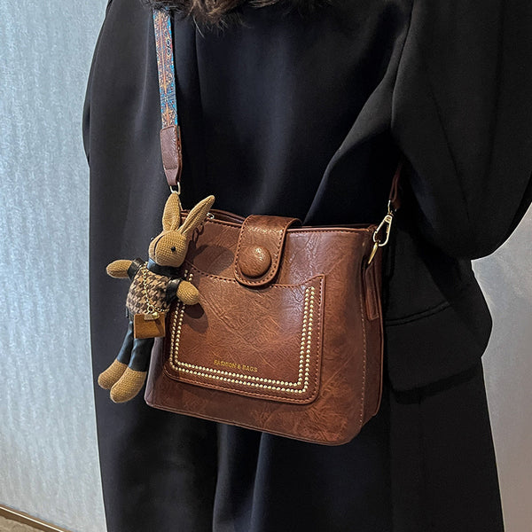 PU Leather Bucket Shoulder Crossbody Bag Patterned Strap Rabbit Charm Red Brown