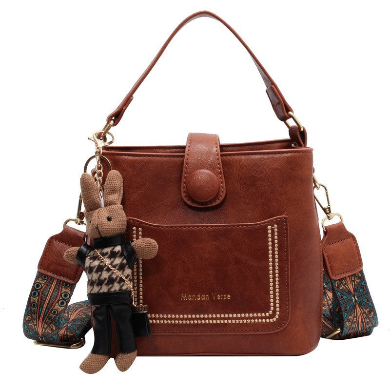 PU Leather Bucket Shoulder Crossbody Bag Patterned Strap Rabbit Charm Caramel