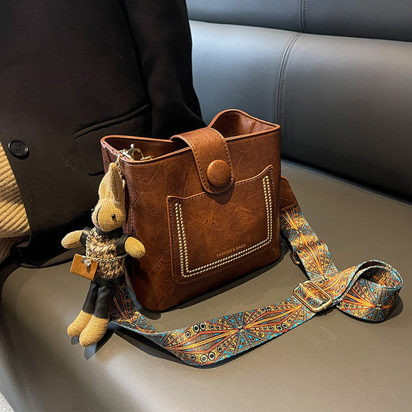 PU Leather Bucket Shoulder Crossbody Bag Patterned Strap Rabbit Charm Caramel