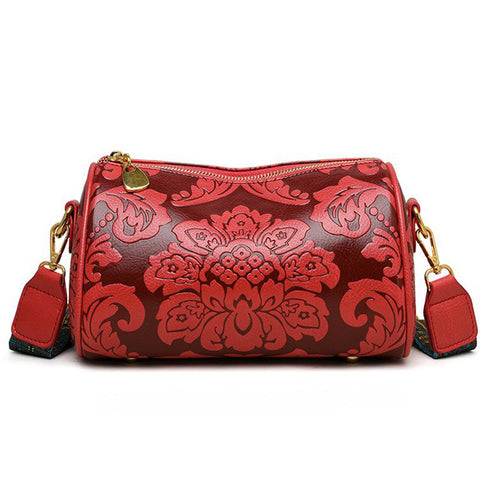 Faux PU Leather Floral Embossed Crossbody Barrel Bag Woven Strap Red