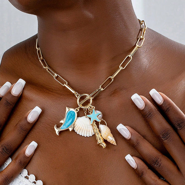 Gold Tone Paperclip Chain Necklace Ocean Charms Dolphin Starfish Seashell