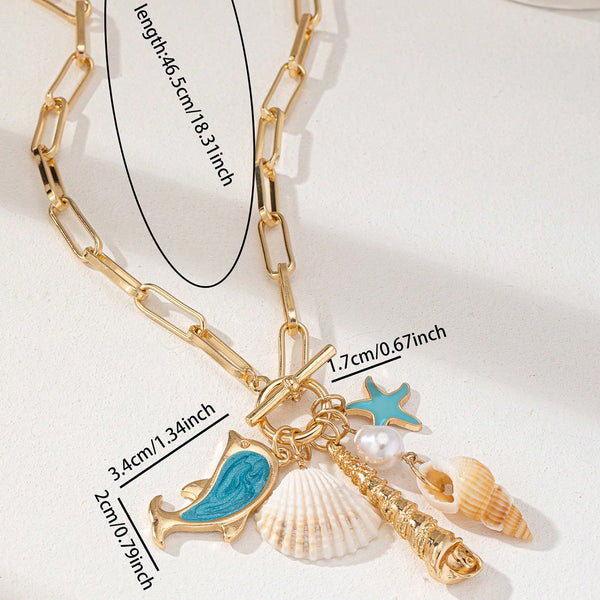 Gold Tone Paperclip Chain Necklace Ocean Charms Dolphin Starfish Seashell
